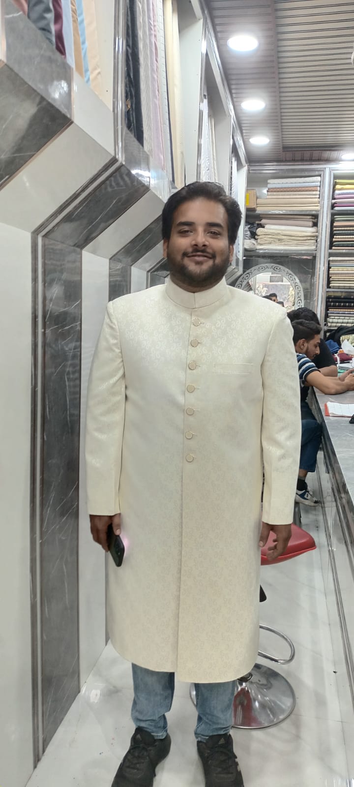 Ivory Brocade Royal Groom Sherwani with Pocket Square Accent